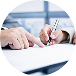 Person signing a paper